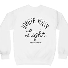 Load image into Gallery viewer, Graphic sweatshirt with a small black lightning bolt on the front and the words ignite your light on the back on a white crewneck sweatshirt