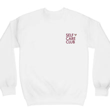 Load image into Gallery viewer, Graphic crewneck sweatshirt with the words self care club in maroon and a rose gold shimmer heart on a white sweatshirt