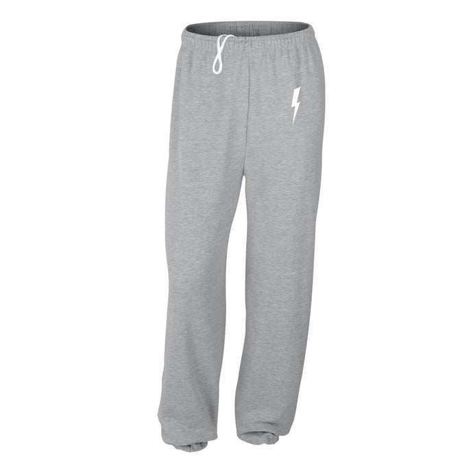 Graphic pants with a small white lightning bolt on grey sweatpants