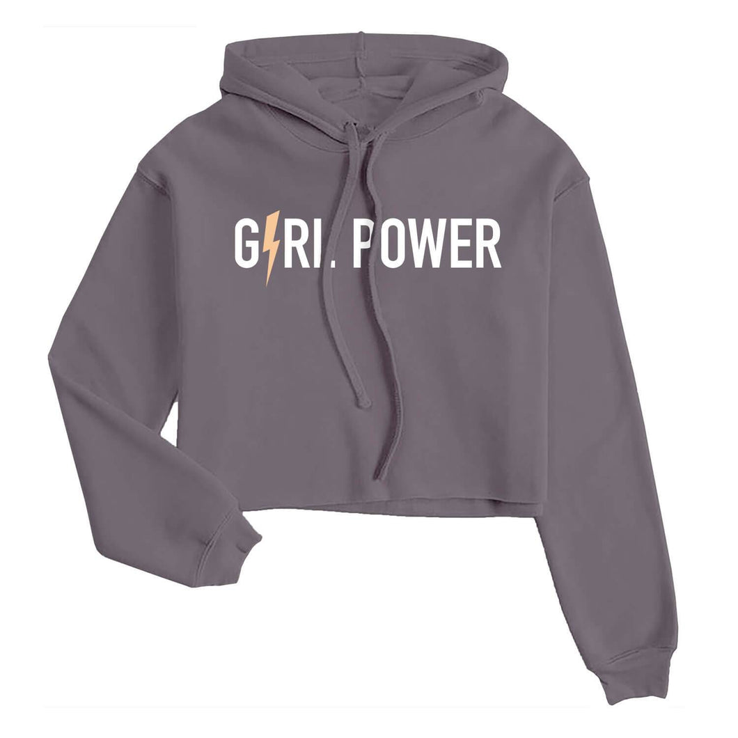 Graphic crop hoodie with the words girl power in white with a peach colored lightning bolt for the letter i on a purple sweatshirt