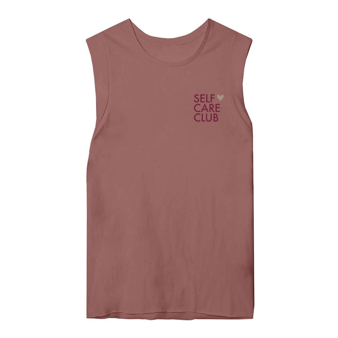 Graphic tank top with the words self care club in maroon and a rose gold shimmer heart on a mauve muscle tank top