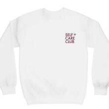 Load image into Gallery viewer, Graphic crewneck sweatshirt with the words self care club in maroon and a rose gold shimmer heart on a white sweatshirt
